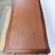 Louis XV style desk in wood, with a brown leather top.
