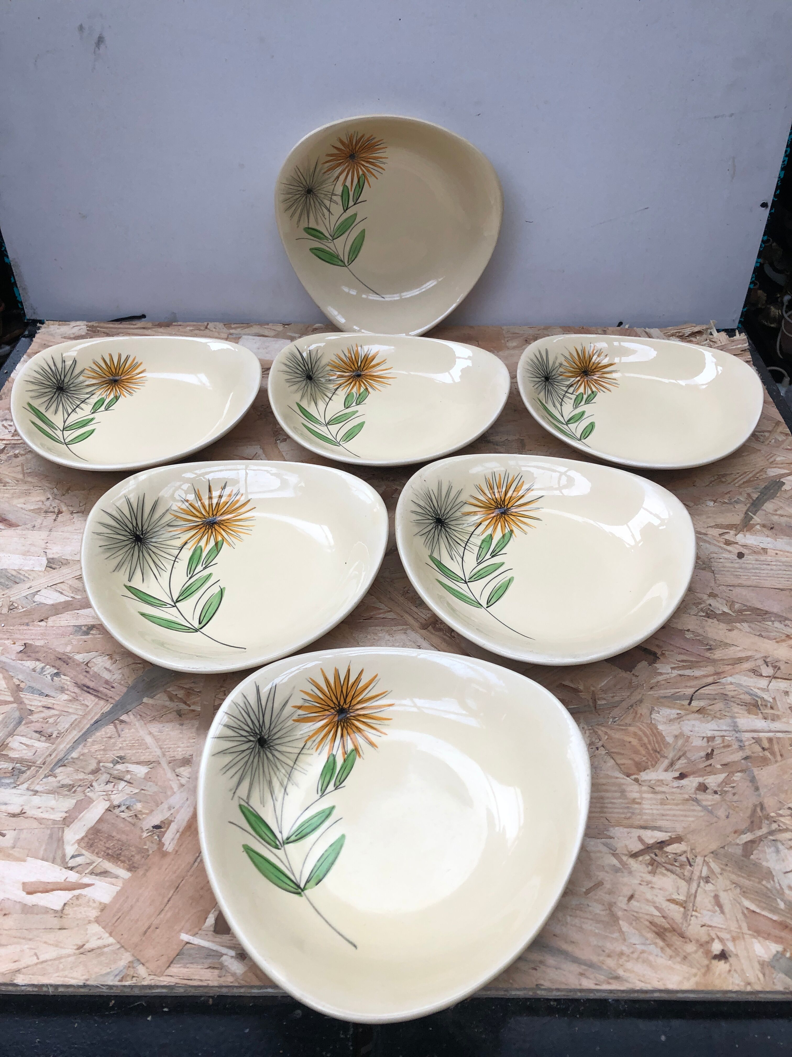 Set of 7 antique St. Clement Sirius pattern ceramic plates