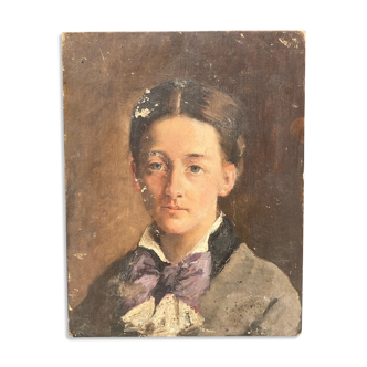 Oil on wood portrait of a young woman at the beginning of the twentieth century