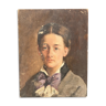 Oil on wood portrait of a young woman at the beginning of the twentieth century