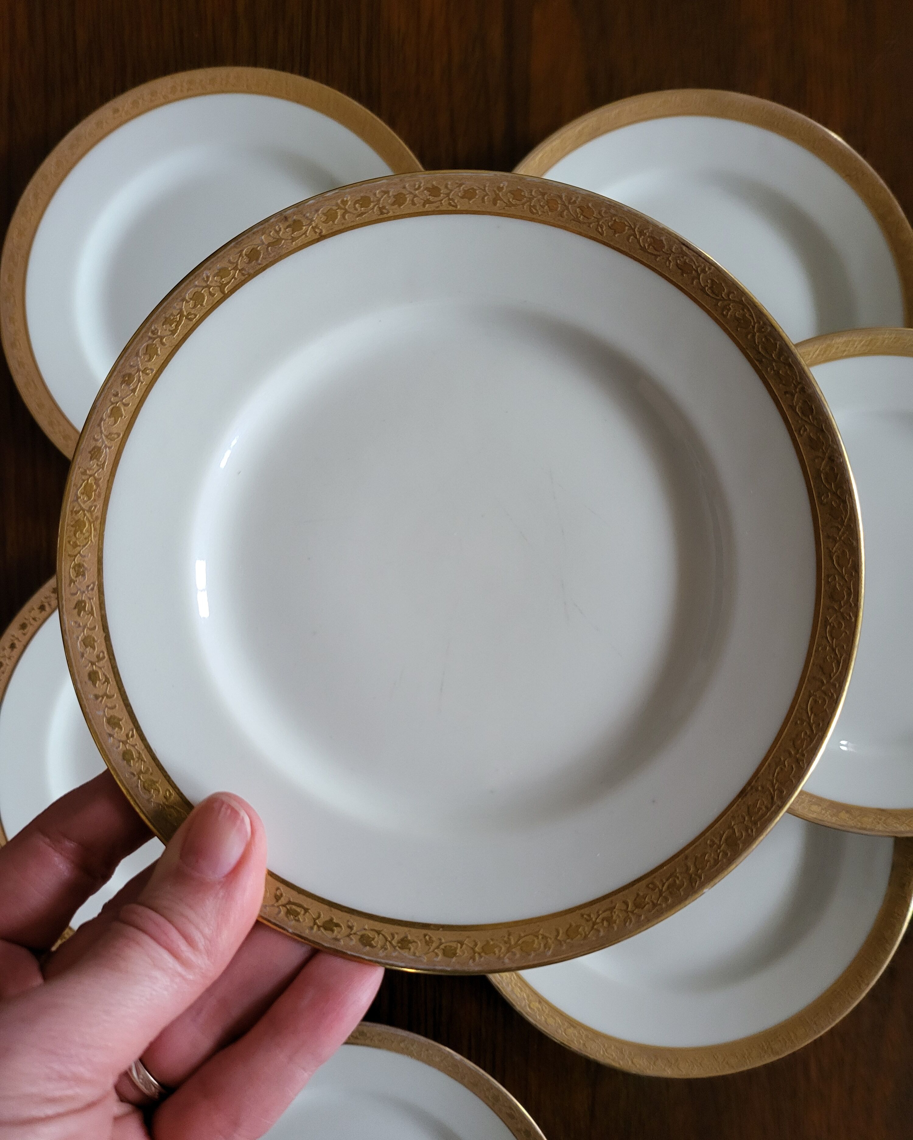 Lot of 8 small porcelain bread plates.