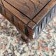 Low stool in carved wood