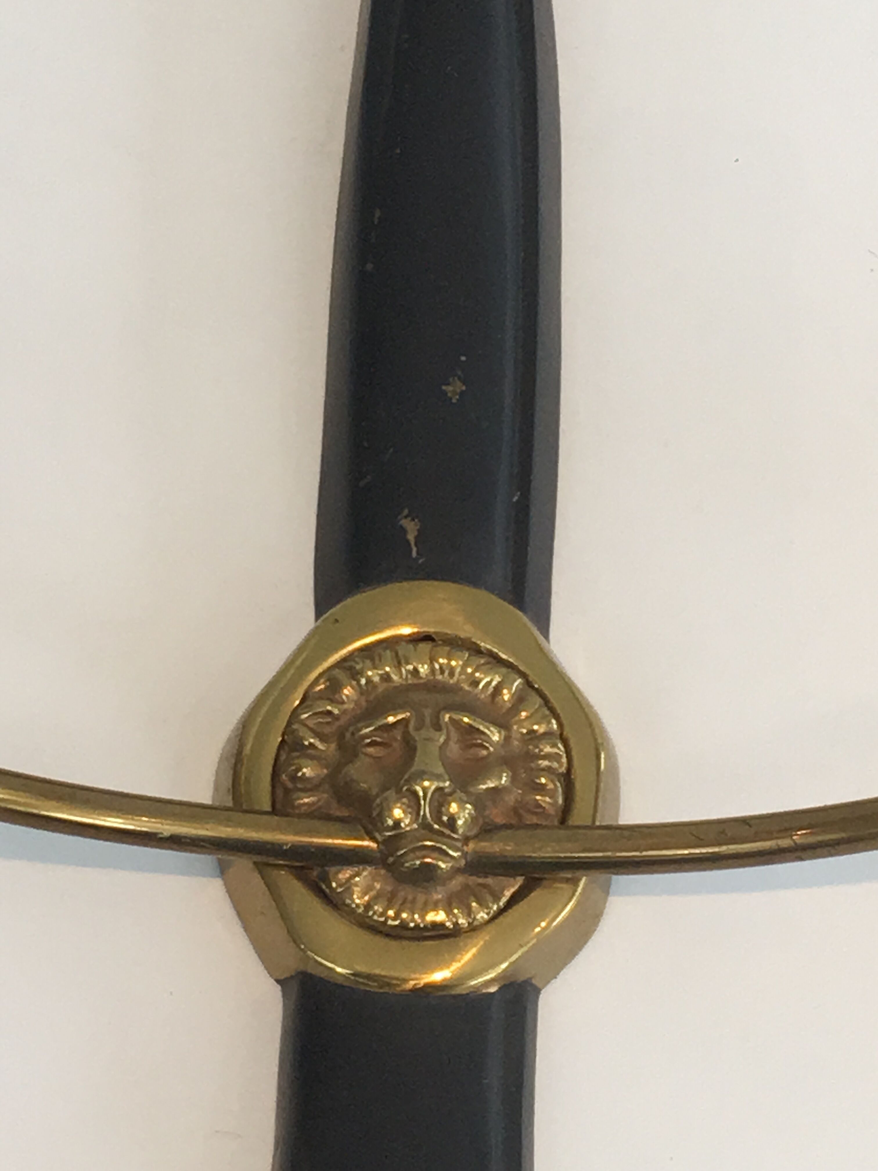 Pair of Black Lacquered Bronze Wall Lamps with Lions' Head Decorations. Around 1970