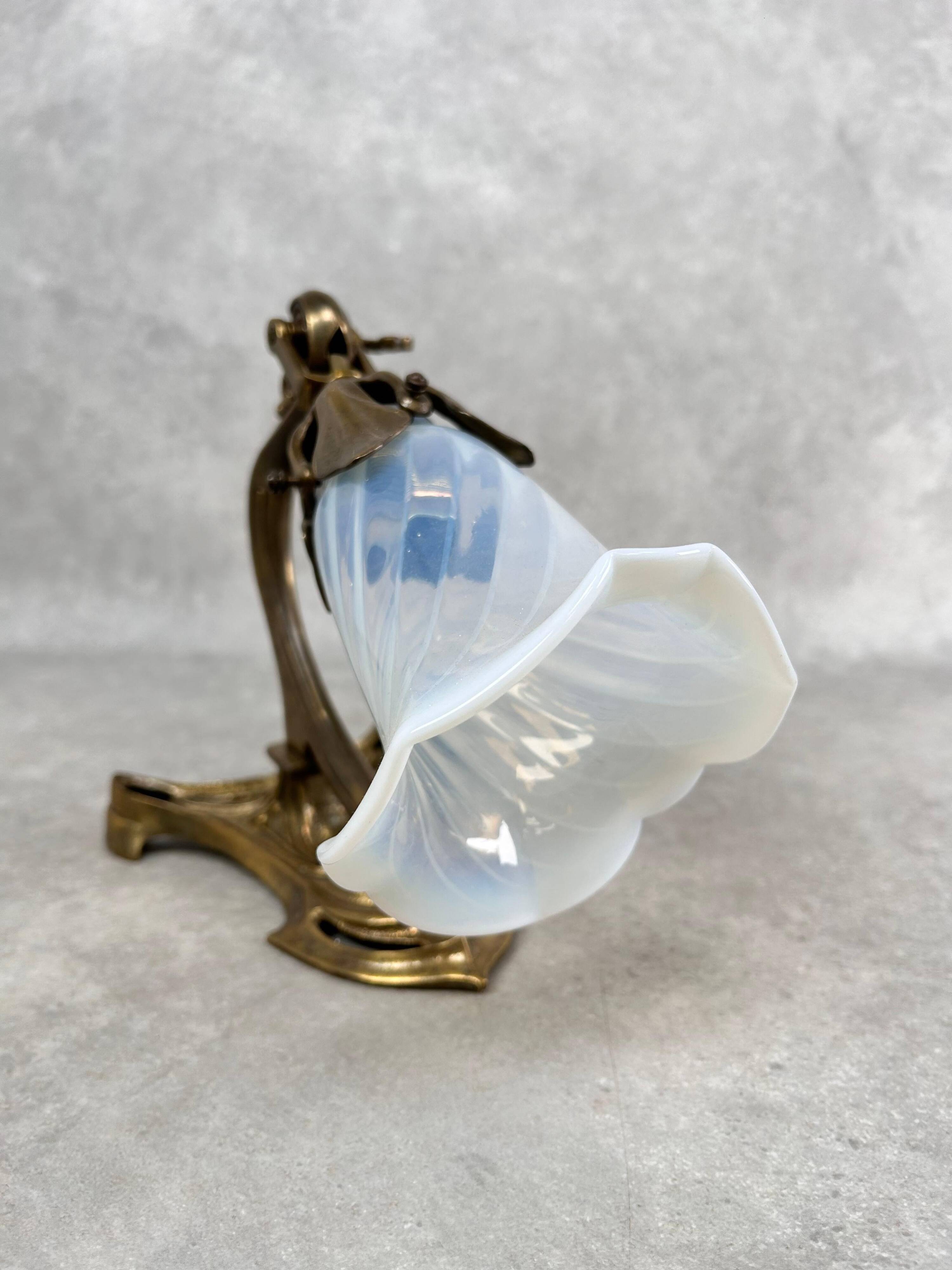 Art Nouveau wall sconces with opalescent iridescent glass