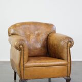 Fauteuil ancien en cuir de mouton