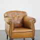 Fauteuil ancien en cuir de mouton