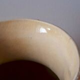 Old enamelled ceramic jug