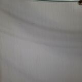 Armoire à barre vintage en forme de cylindre ouvrable, bois, laiton et verre.