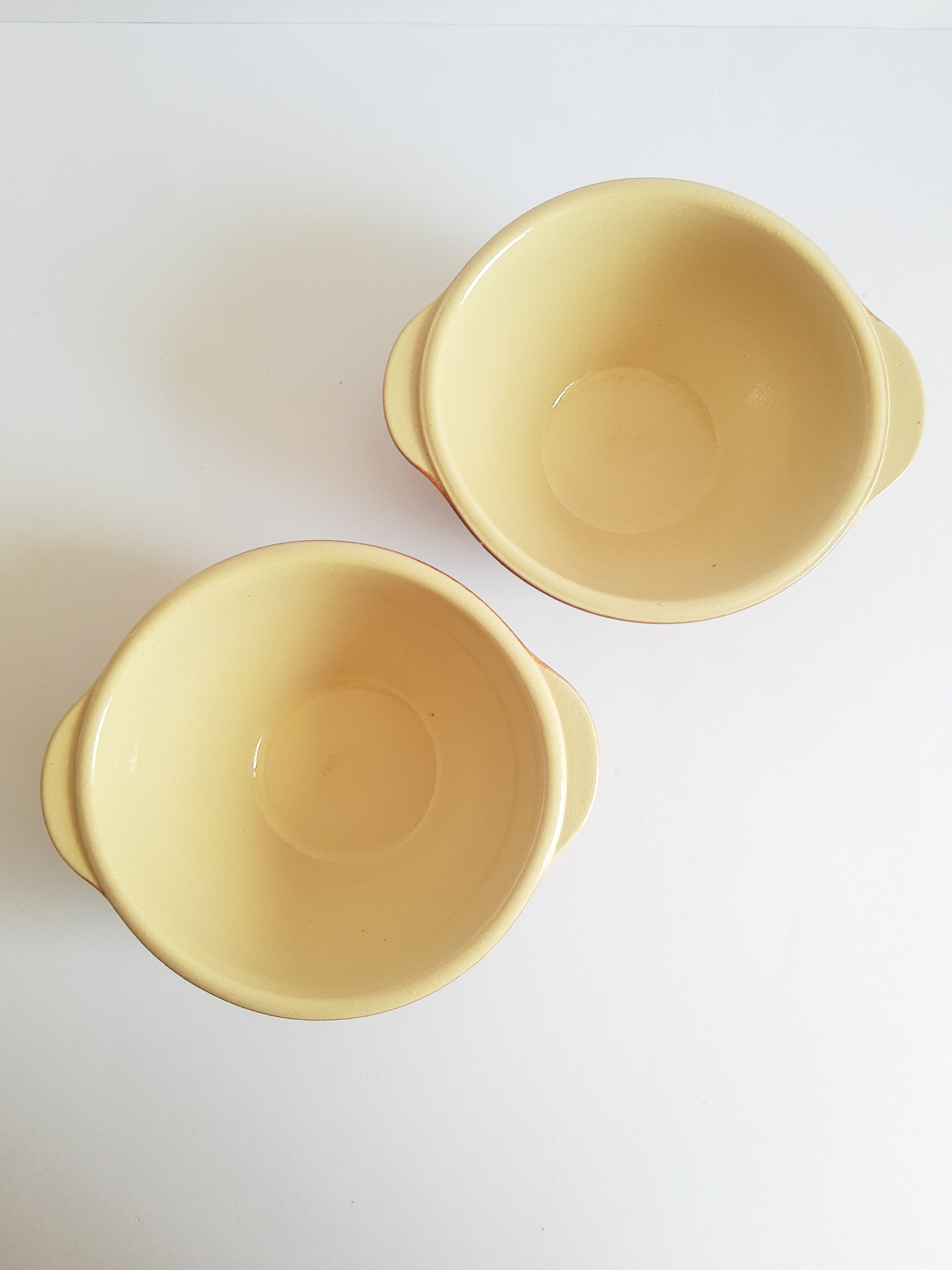 Duo of vintage Emile Henry cognac ear bowls