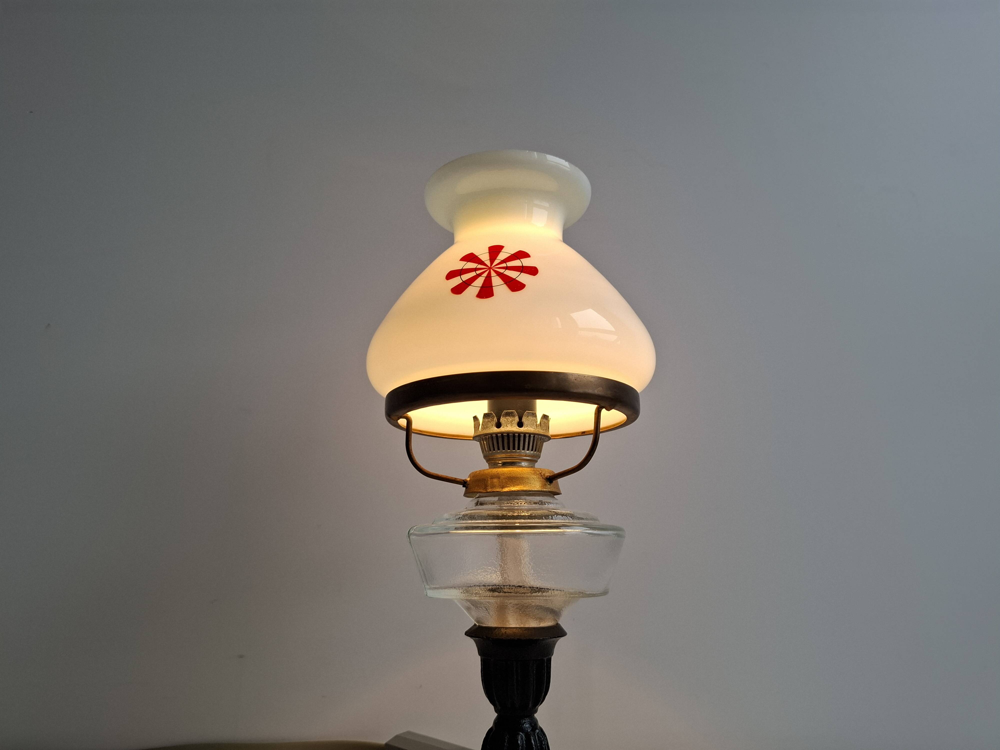1960s Czechoslovakian milk glass oil lamp style table lamp with red windmill