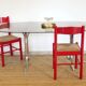 Dining table with smoked glass top and chrome base.