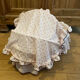 1960s wicker cradle with mattress and drapes.