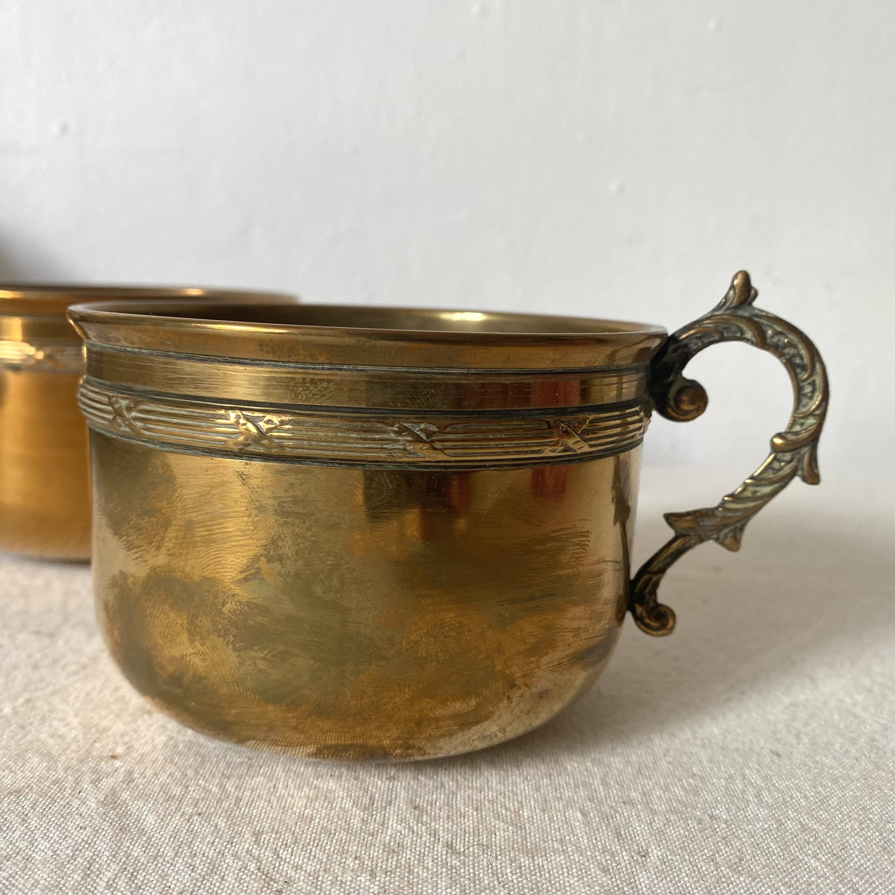Antique brass cups