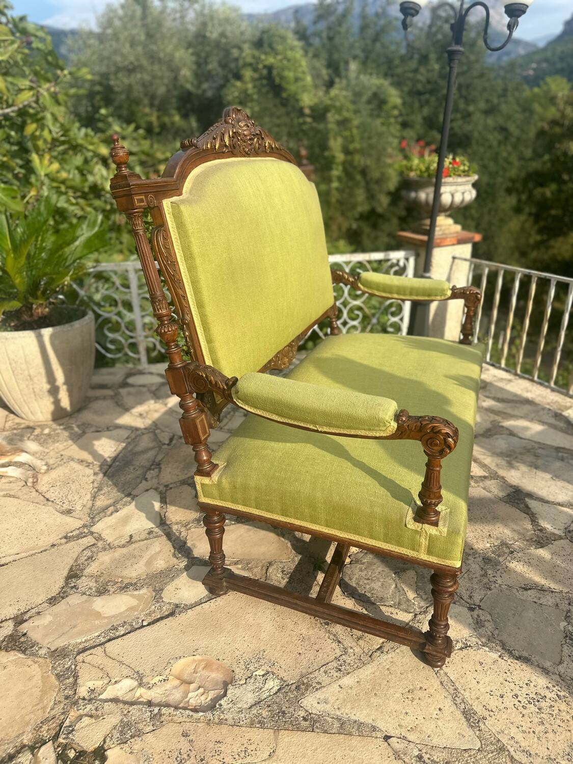Richly carved solid wood bench in Louis XVI style.