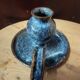 Pair of speckled glazed ceramic candle holders rat of the cellar