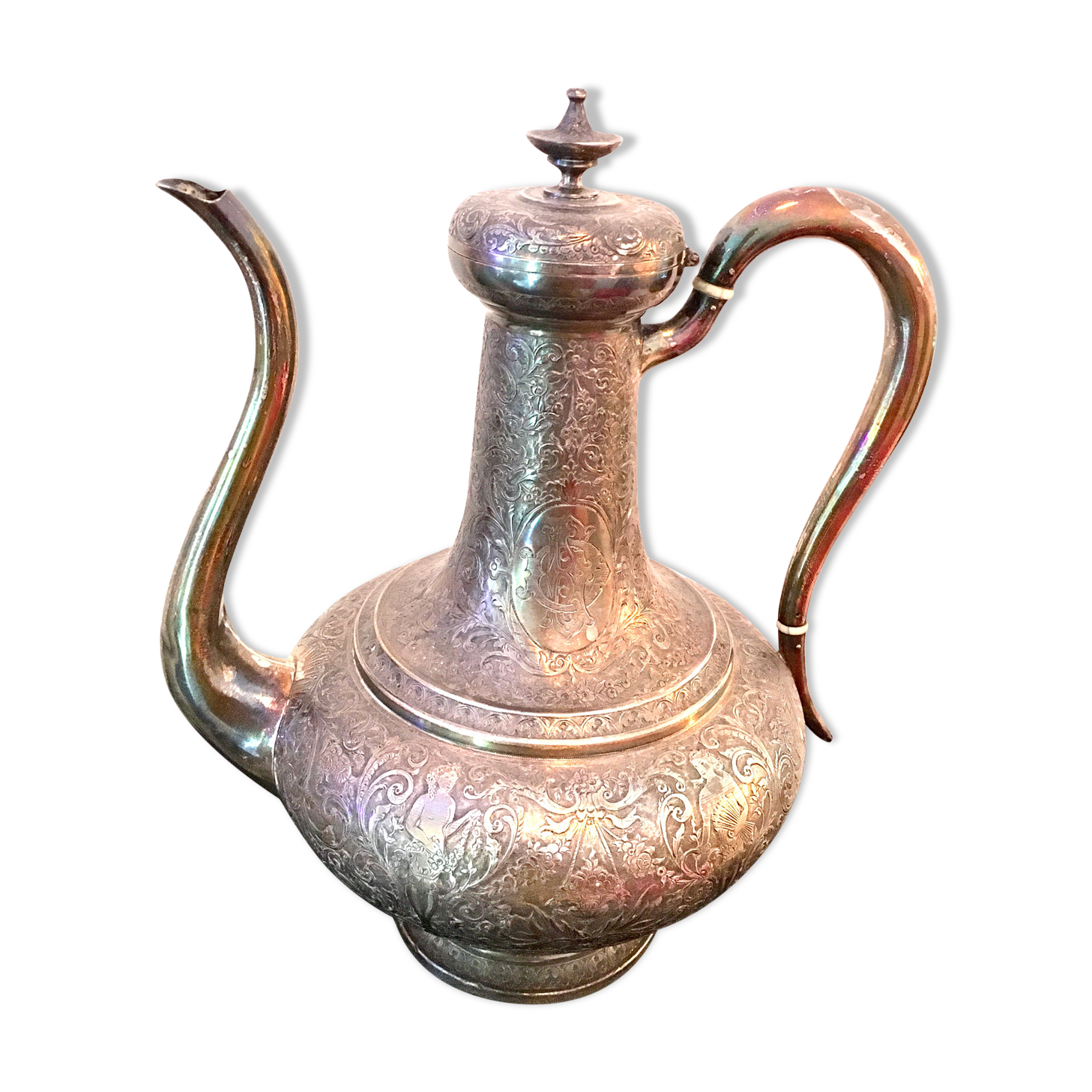 Oriental teapot made of crafted silver metal