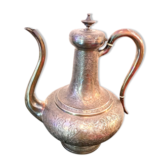 Oriental teapot made of crafted silver metal