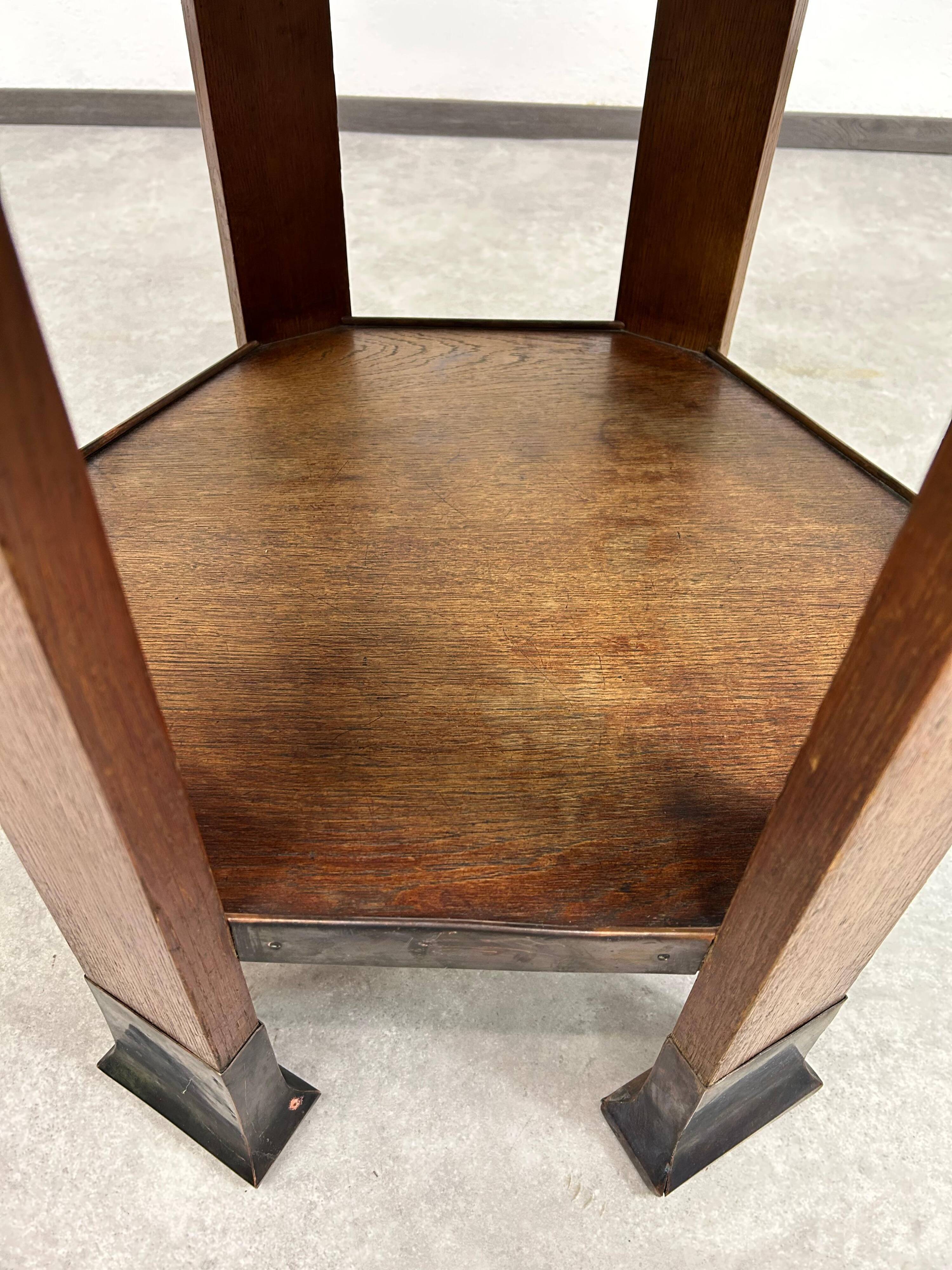 Hexagonal table with six legs in Secession style bordered with brass, attributed to Adolf Loos.