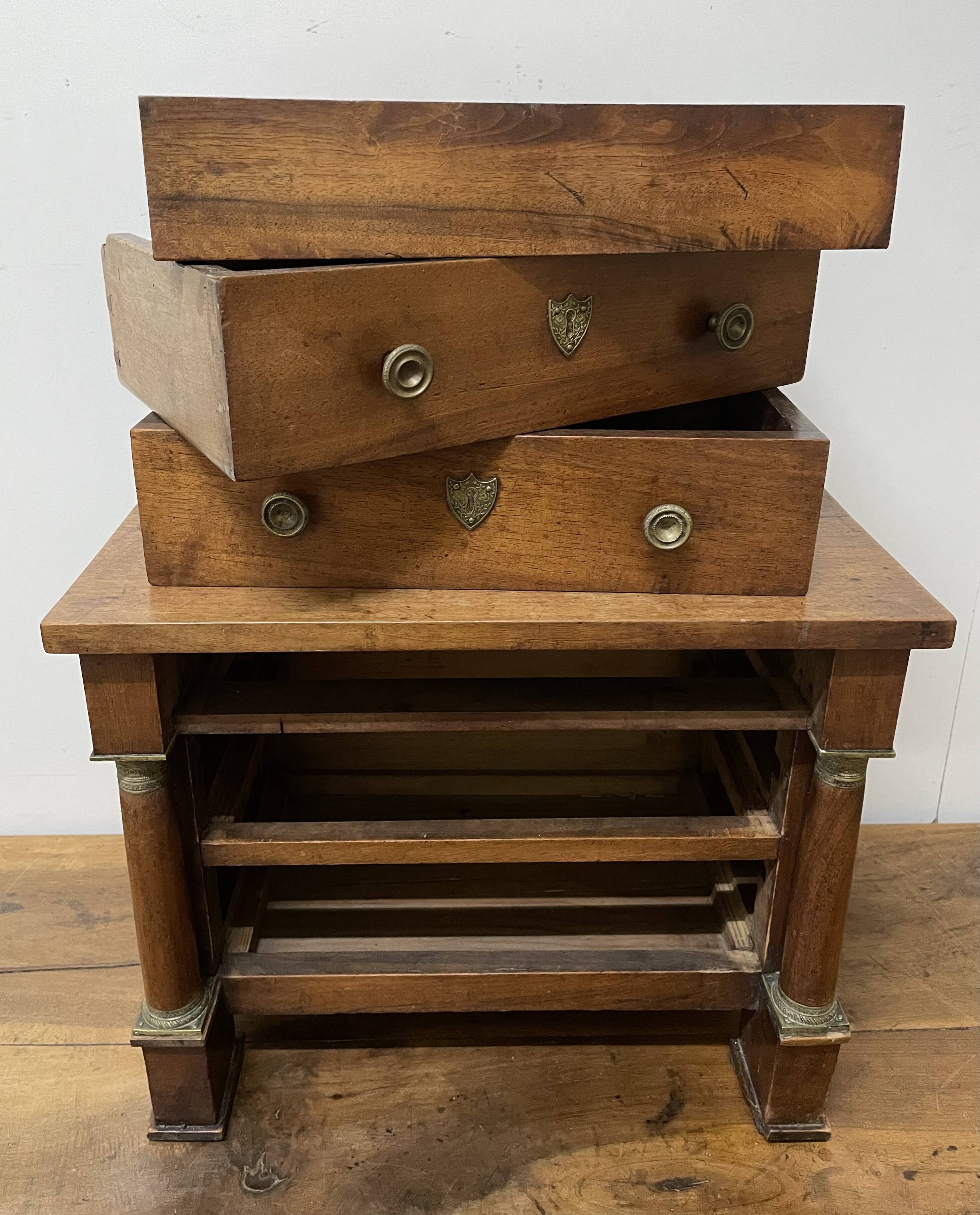 19th century Empire style walnut chest of drawers. It opens with 3 drawers in