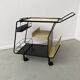 Perforated metal serving trolley in the Mathieu Matégot style