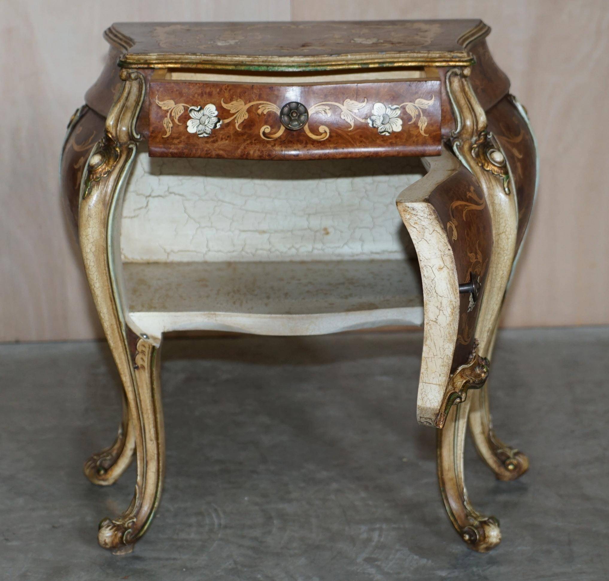 Pair of curved walnut commodes with marquetry and marble tops.