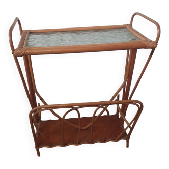 vintage rattan magazine rack with glass top, missing a rim of the magazine rack