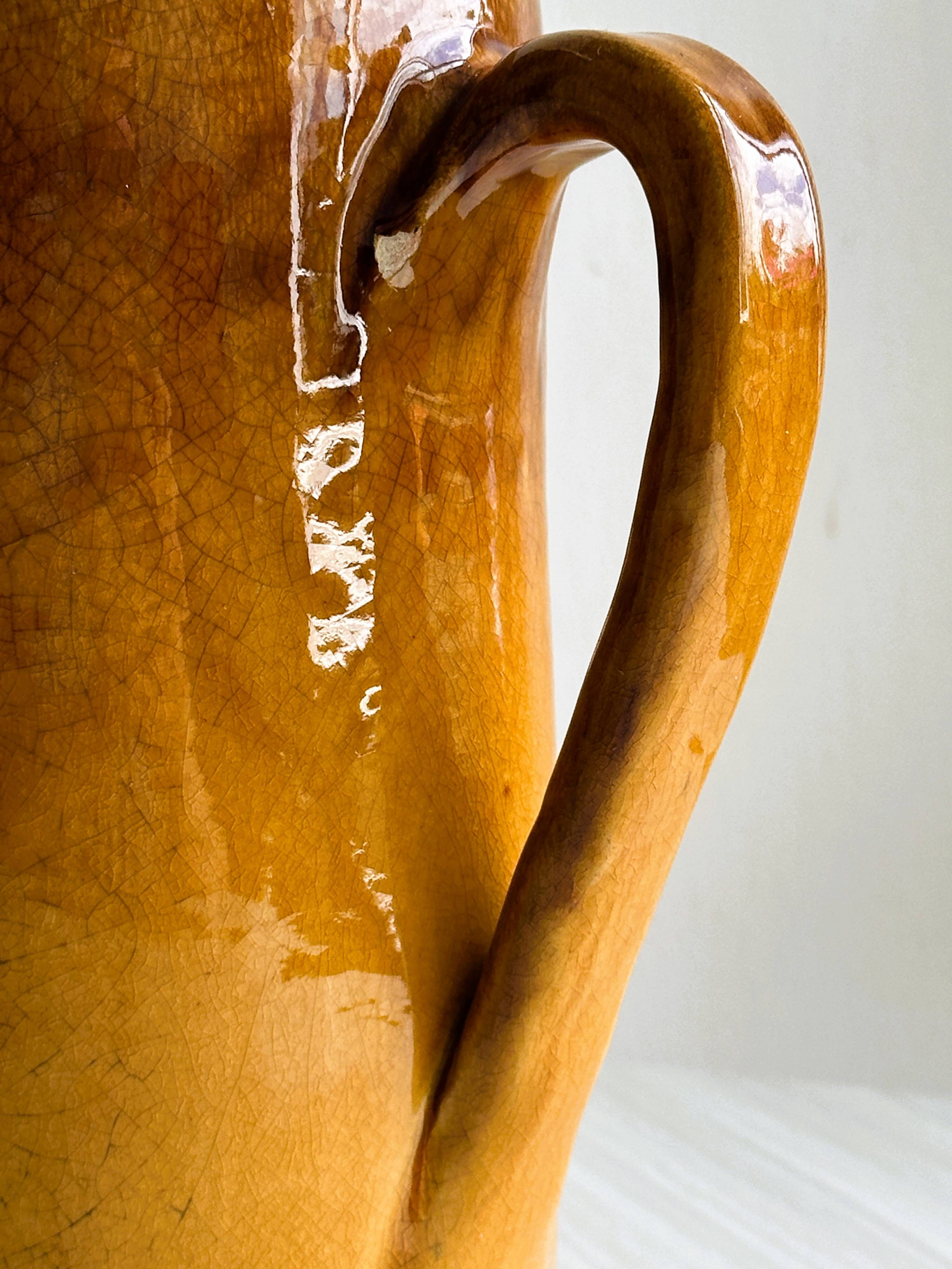 Vintage enameled ceramic watering can vase - retro mustard yellow pot.