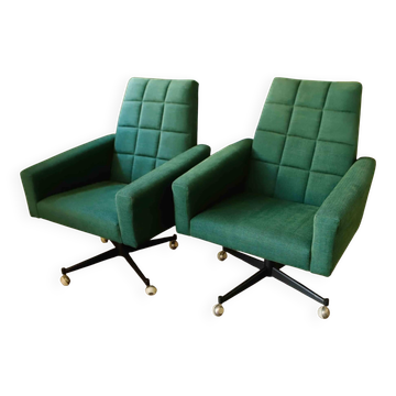 Pair of retro swivel chairs on casters