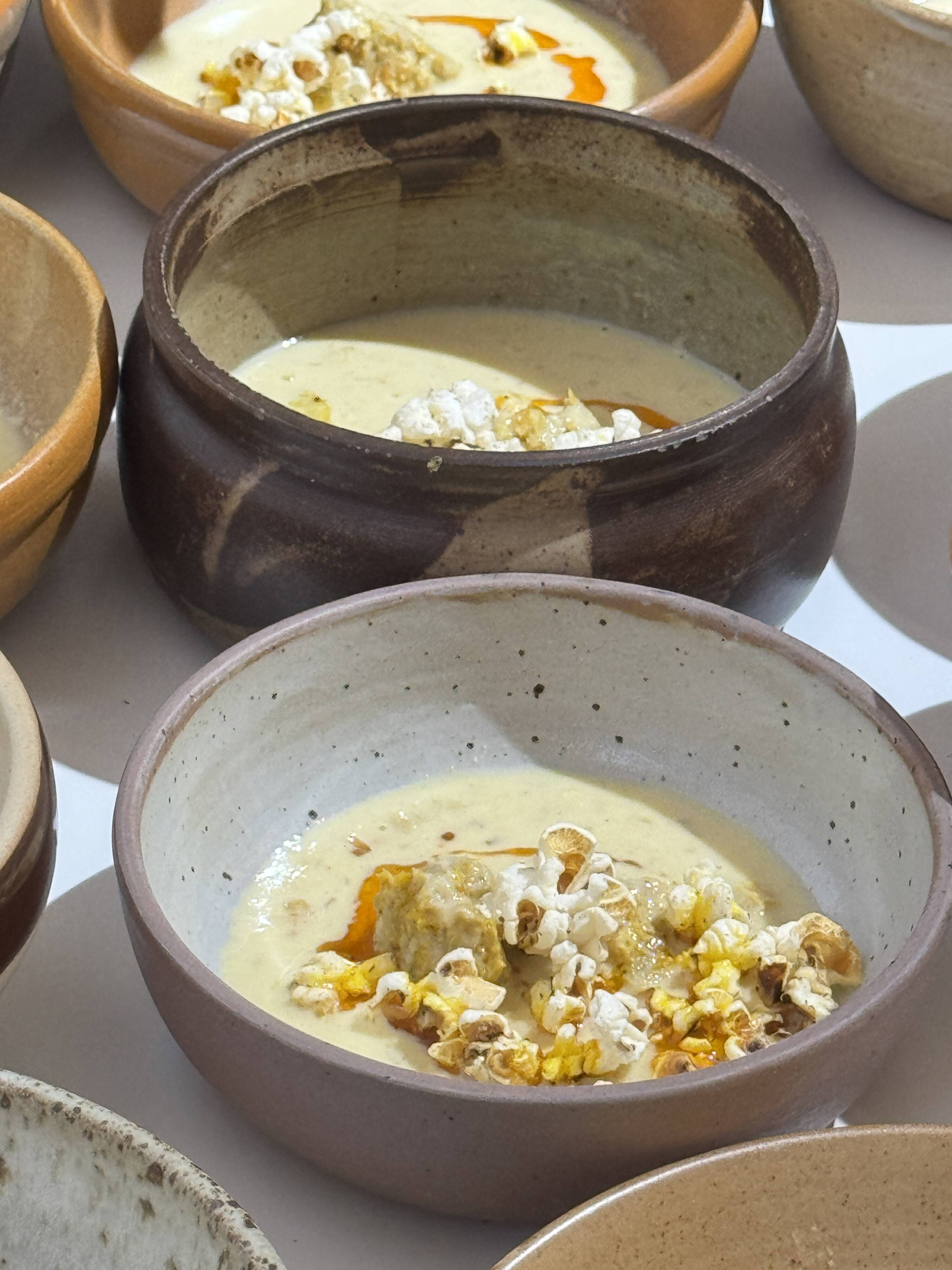 A small stoneware bowl, brown exterior, speckled grey interior D15