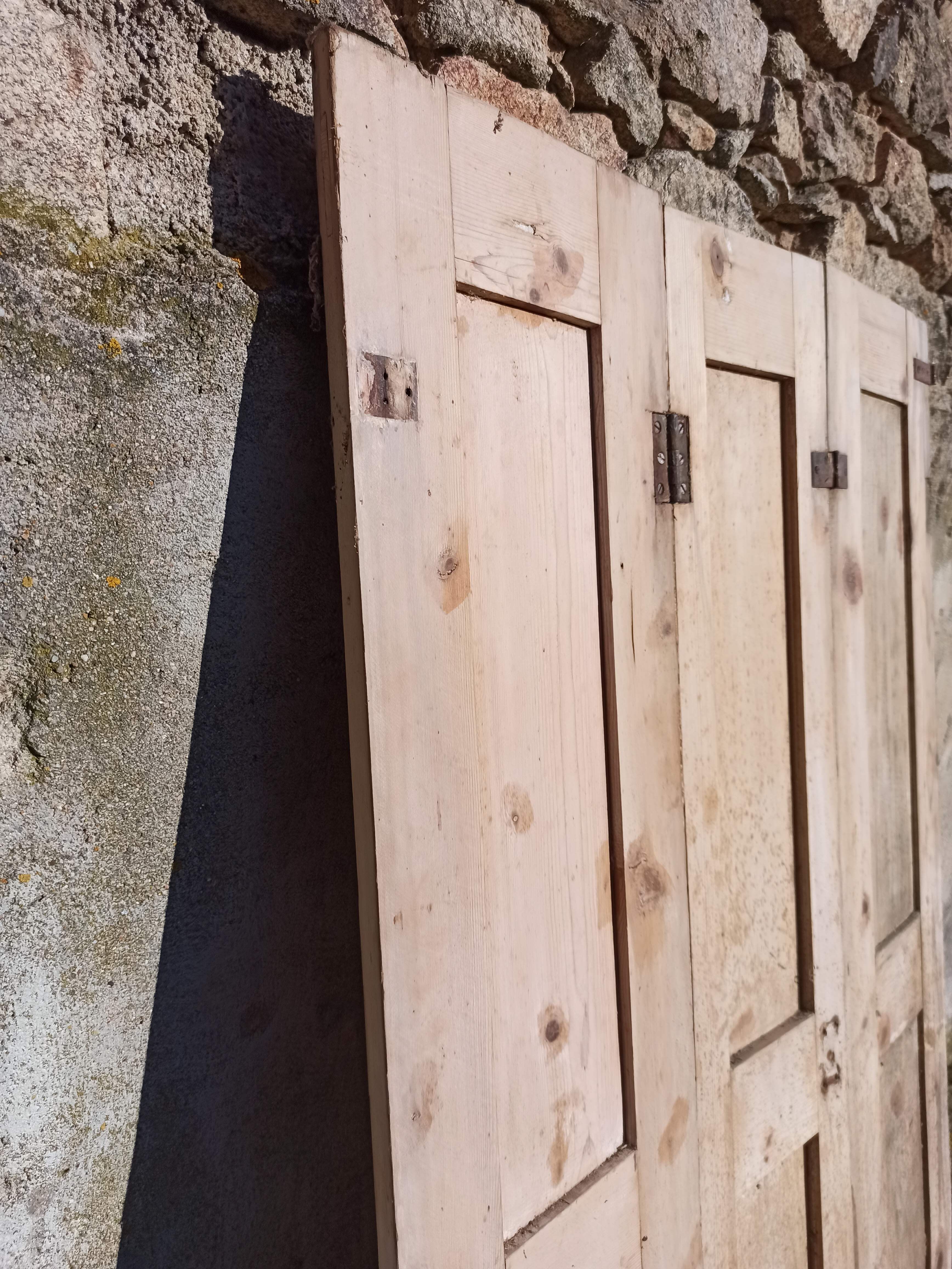 Old trio of wooden screen doors