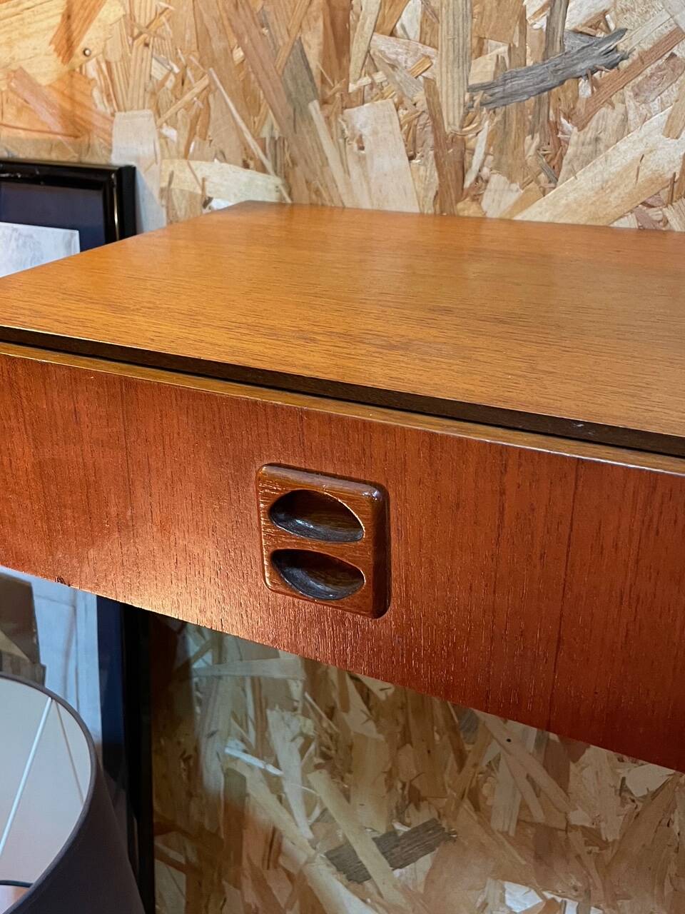 Suspended teak bedside tables in vintage 1960s Scandinavian style.