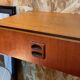 Suspended teak bedside tables in vintage 1960s Scandinavian style.
