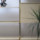 Ivory and brass lacquered library, International furniture 1970