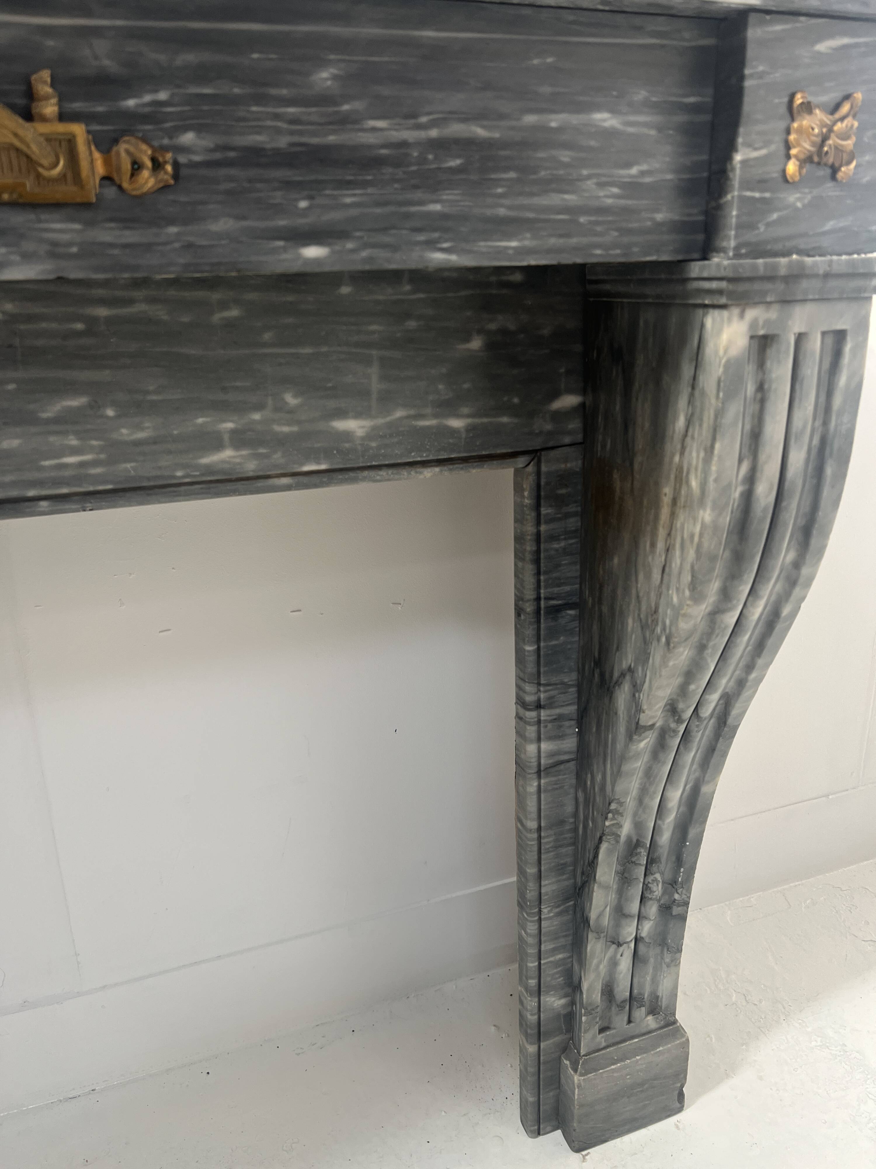 Napoleon III fireplace in blue Turquin marble from the 19th century.