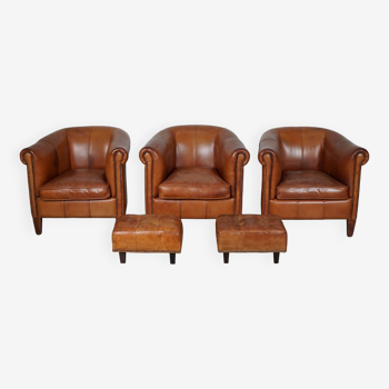 Vintage dutch cognac leather club chairs, set of three with two footstools