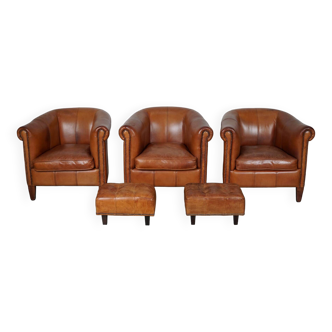 Vintage dutch cognac leather club chairs, set of three with two footstools