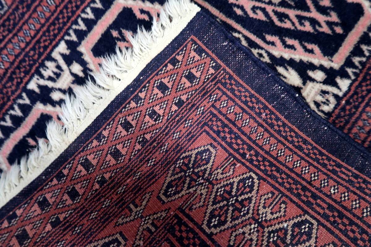 Handmade vintage 1960s Uzbek Bukhara rug – small wool tribal carpet (65cm x 95cm)