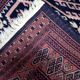 Handmade vintage 1960s Uzbek Bukhara rug – small wool tribal carpet (65cm x 95cm)