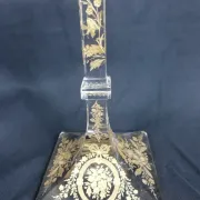 Antique glass candle holder, engraved and gilded.