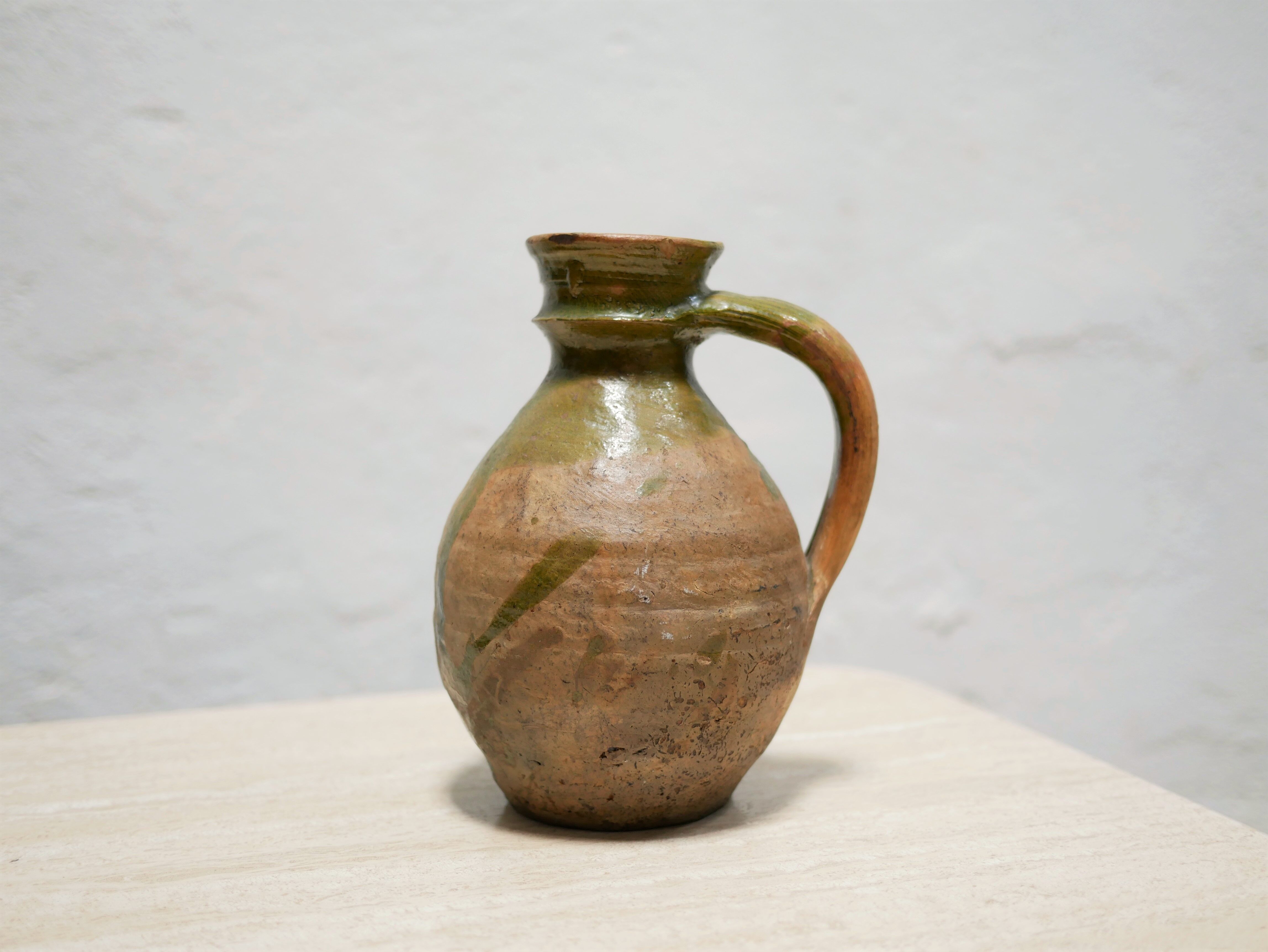 Old glazed terracotta jar