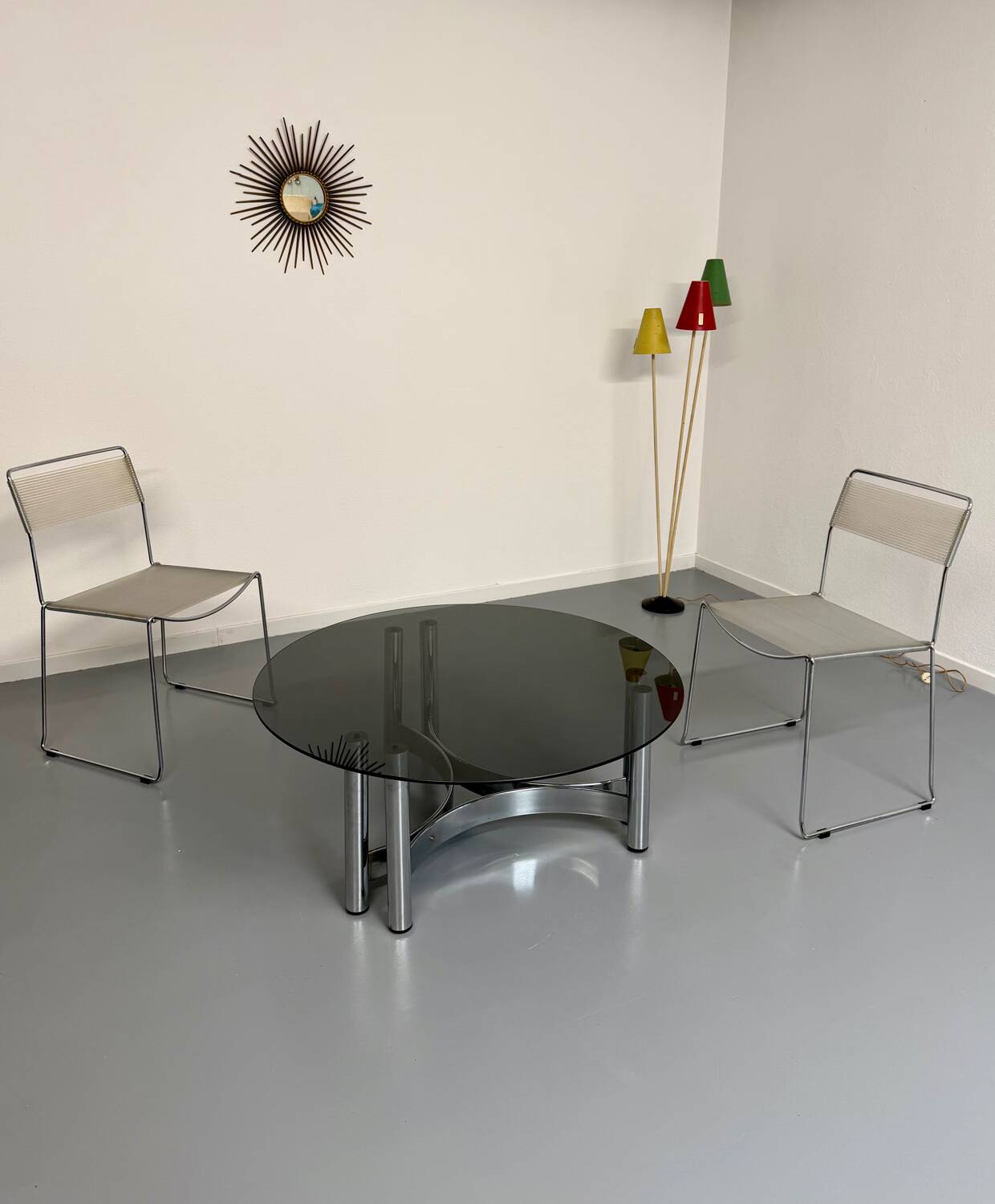 Round coffee table in smoked glass and chrome steel, 1970s design.