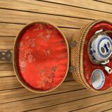 Asian teapot in basket