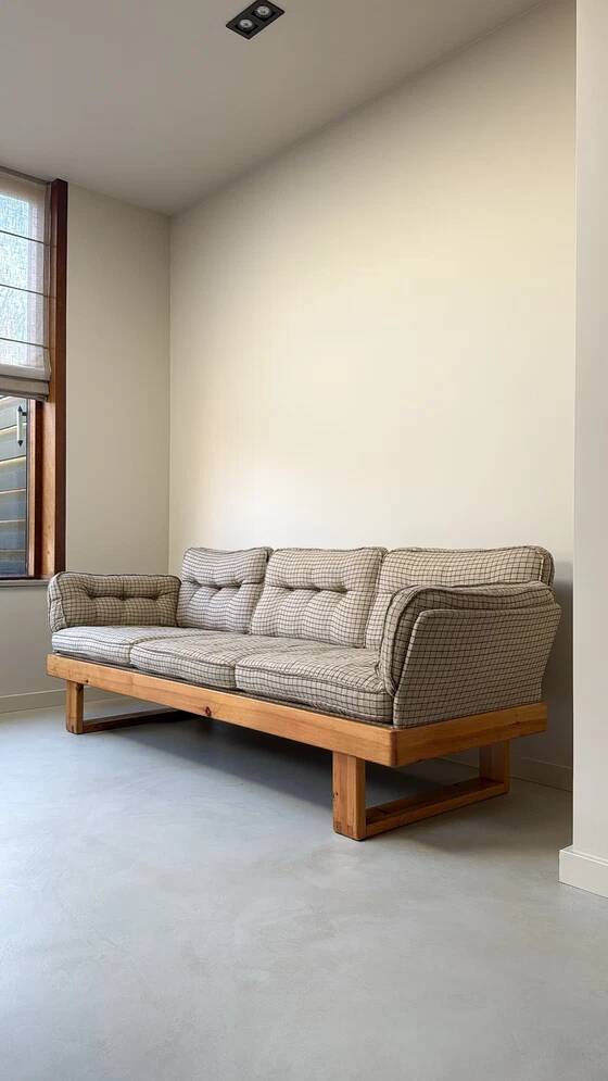 Two vintage Swedish sofas and a pine table