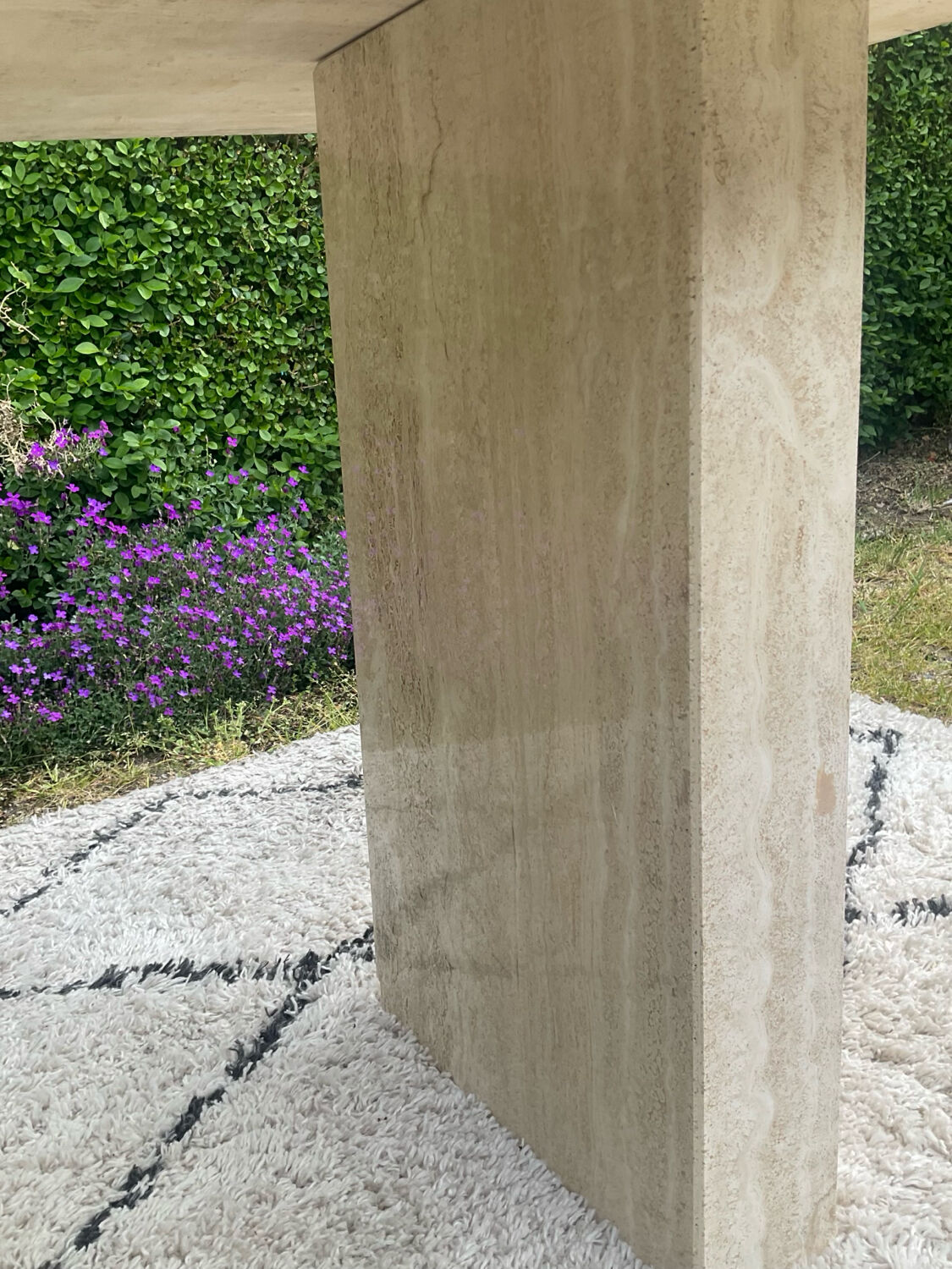 Large vintage dining table in travertine in the 1970s Carpa style.