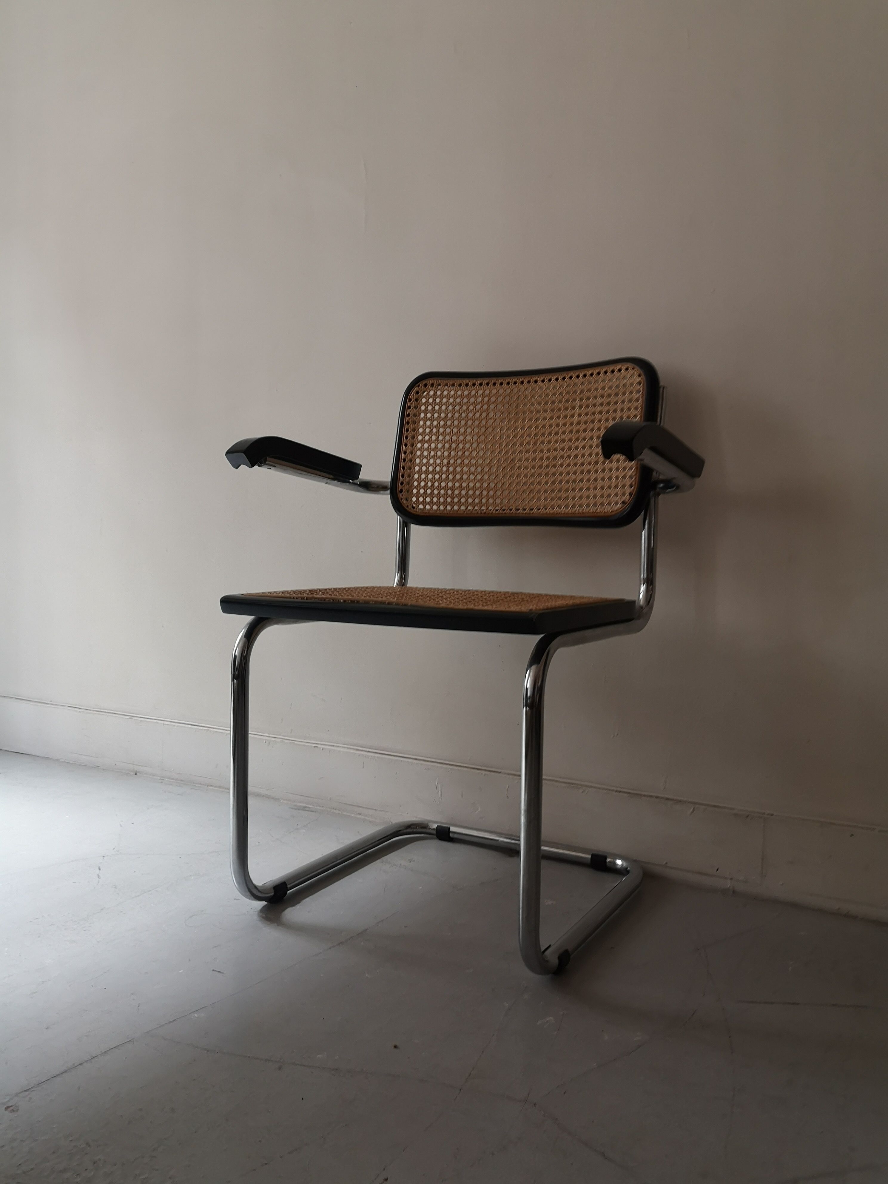 Cesca armchair with metal and wood armrest by Marcel Breuer