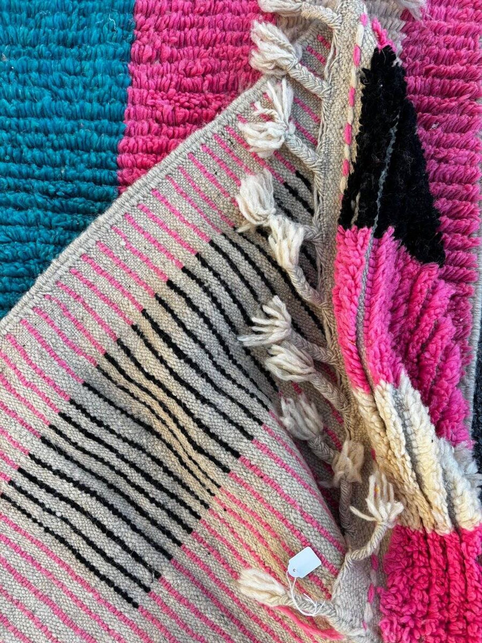 Moroccan Berber rug corridor in pink and blue wool.