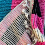 Moroccan Berber rug corridor in pink and blue wool.