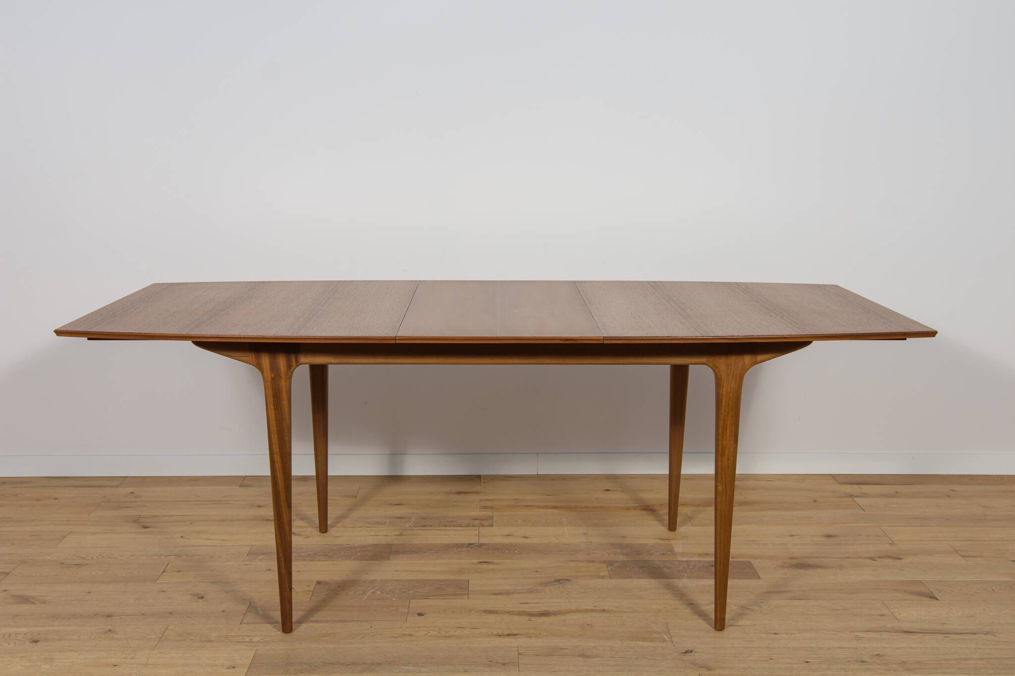 Mid-century teak extending dining table from McIntosh, UK.