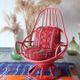 Restored vintage 70s armchair with custom-made Moroccan cushions, pink and red armchair