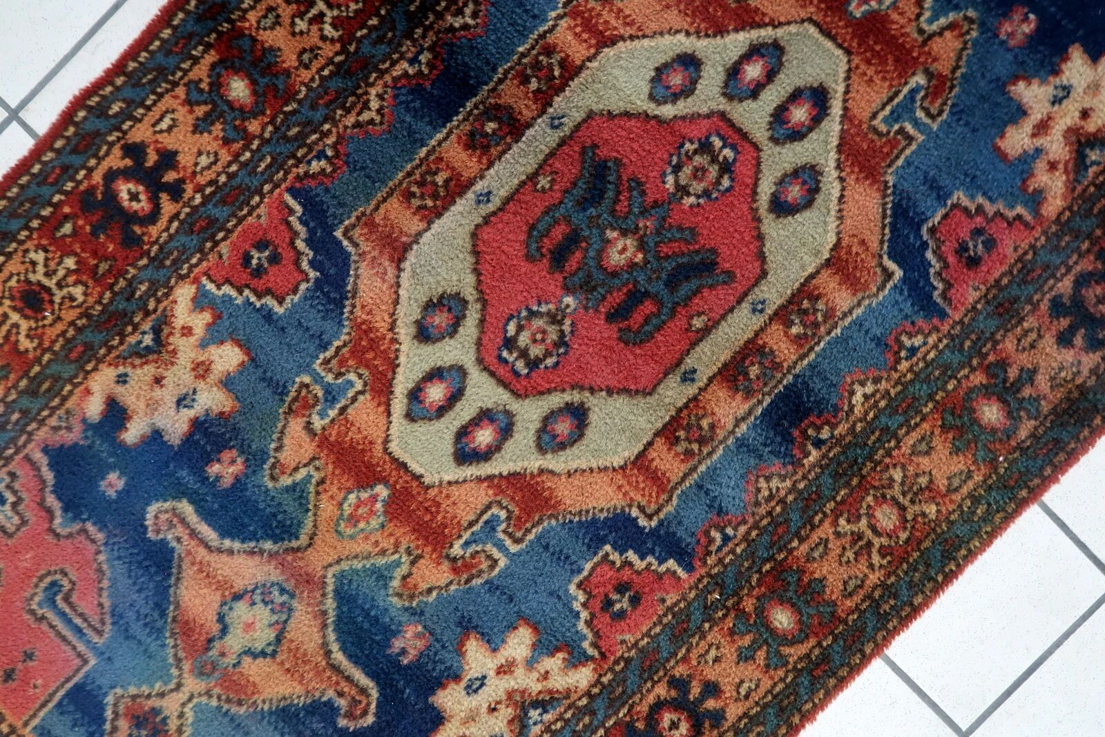 Vintage 1950s German tribal style wool rug, geometric medallion, 84cm x 180cm